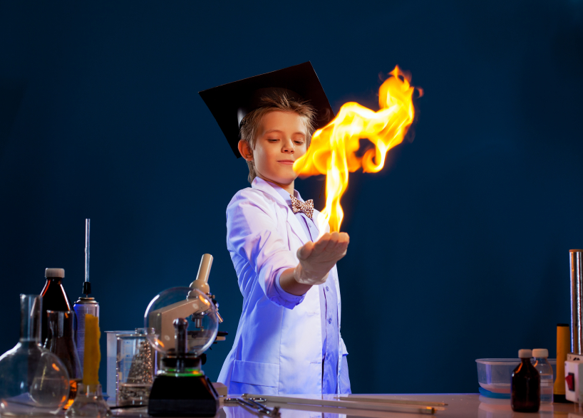 Image of witted boy holding fire in his hands